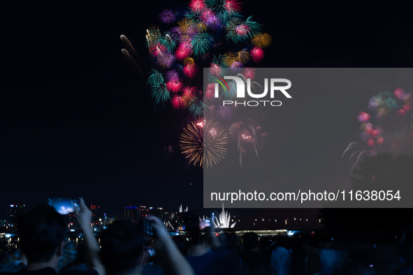 Fireworks illuminate the skyline of Yeouido during the Seoul International Fireworks Festival, drawing thousands of spectators and photograp...