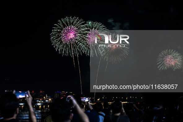 Fireworks illuminate the skyline of Yeouido during the Seoul International Fireworks Festival, drawing thousands of spectators and photograp...