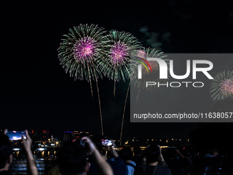 Fireworks illuminate the skyline of Yeouido during the Seoul International Fireworks Festival, drawing thousands of spectators and photograp...