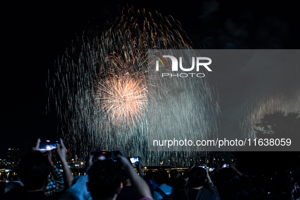 Fireworks illuminate the skyline of Yeouido during the Seoul International Fireworks Festival, drawing thousands of spectators and photograp...