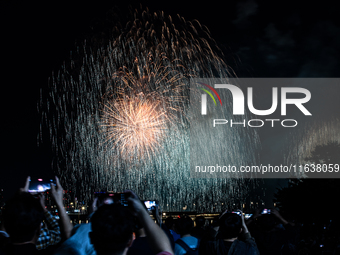 Fireworks illuminate the skyline of Yeouido during the Seoul International Fireworks Festival, drawing thousands of spectators and photograp...