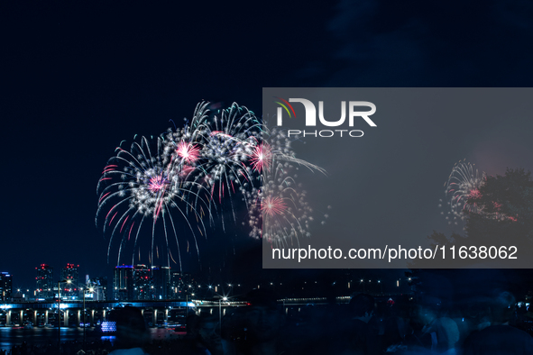 Fireworks illuminate the skyline of Yeouido during the Seoul International Fireworks Festival, drawing thousands of spectators and photograp...