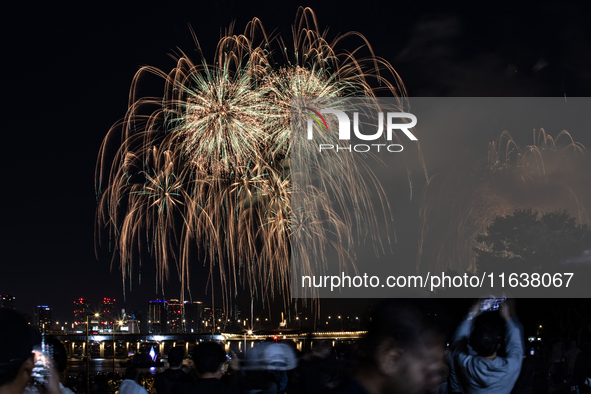 Fireworks illuminate the skyline of Yeouido during the Seoul International Fireworks Festival, drawing thousands of spectators and photograp...