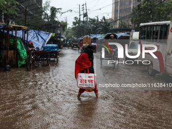 Continuous rain causes waterlogging in different areas of the capital, disrupting the daily life of the residents, on October 5, 2024. (