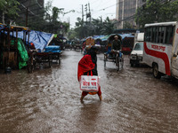 Continuous rain causes waterlogging in different areas of the capital, disrupting the daily life of the residents, on October 5, 2024. (