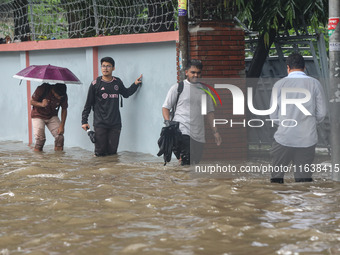 Continuous rain causes waterlogging in different areas of the capital, disrupting the daily life of the residents, on October 5, 2024. (