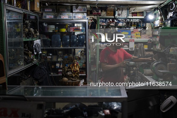 A man works at the vehicle parts shop in Colombo, Sri Lanka, on October 5, 2024 