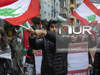 Demonstrators march through the streets of Sofia, Bulgaria, on October 5, 2024, against Israeli strikes in Gaza and Lebanon. (