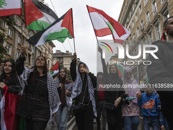 Demonstrators march through the streets of Sofia, Bulgaria, on October 5, 2024, against Israeli strikes in Gaza and Lebanon. (