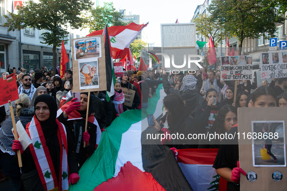 A thousand protesters take part in a protest demanding a ceasefire and opposing ongoing Israeli attacks on Gaza and Lebanon in Duesseldorf,...