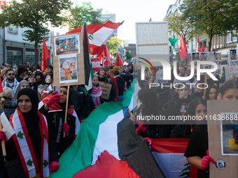 A thousand protesters take part in a protest demanding a ceasefire and opposing ongoing Israeli attacks on Gaza and Lebanon in Duesseldorf,...