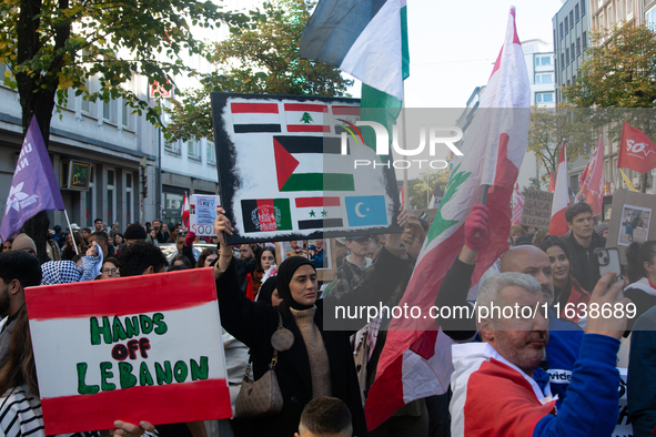 A thousand protesters take part in a protest demanding a ceasefire and opposing ongoing Israeli attacks on Gaza and Lebanon in Duesseldorf,...