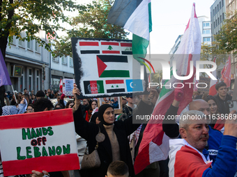 A thousand protesters take part in a protest demanding a ceasefire and opposing ongoing Israeli attacks on Gaza and Lebanon in Duesseldorf,...