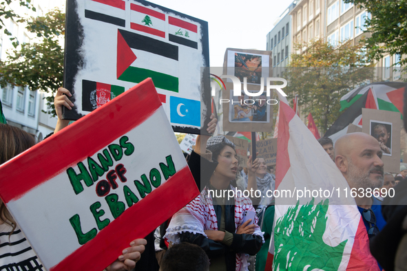 A thousand protesters take part in a protest demanding a ceasefire and opposing ongoing Israeli attacks on Gaza and Lebanon in Duesseldorf,...