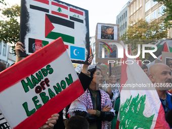 A thousand protesters take part in a protest demanding a ceasefire and opposing ongoing Israeli attacks on Gaza and Lebanon in Duesseldorf,...