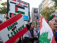 A thousand protesters take part in a protest demanding a ceasefire and opposing ongoing Israeli attacks on Gaza and Lebanon in Duesseldorf,...