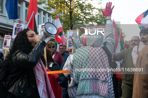 A thousand protesters take part in a protest demanding a ceasefire and opposing ongoing Israeli attacks on Gaza and Lebanon in Duesseldorf,...