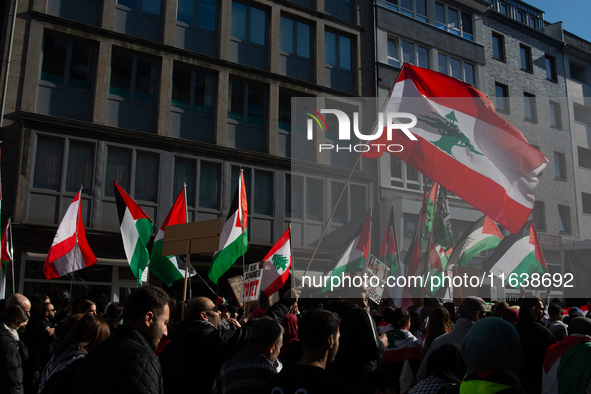 A thousand protesters take part in a protest demanding a ceasefire and opposing ongoing Israeli attacks on Gaza and Lebanon in Duesseldorf,...