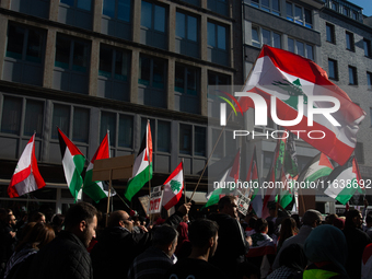 A thousand protesters take part in a protest demanding a ceasefire and opposing ongoing Israeli attacks on Gaza and Lebanon in Duesseldorf,...