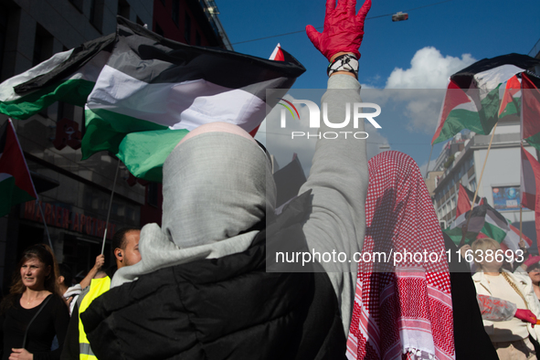 A thousand protesters take part in a protest demanding a ceasefire and opposing ongoing Israeli attacks on Gaza and Lebanon in Duesseldorf,...