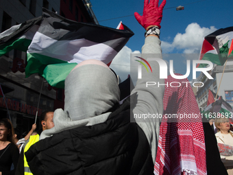 A thousand protesters take part in a protest demanding a ceasefire and opposing ongoing Israeli attacks on Gaza and Lebanon in Duesseldorf,...