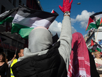 A thousand protesters take part in a protest demanding a ceasefire and opposing ongoing Israeli attacks on Gaza and Lebanon in Duesseldorf,...