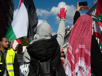 A thousand protesters take part in a protest demanding a ceasefire and opposing ongoing Israeli attacks on Gaza and Lebanon in Duesseldorf,...