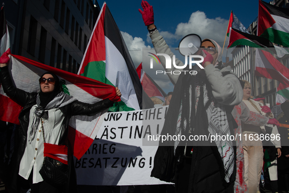 A thousand protesters take part in a protest demanding a ceasefire and opposing ongoing Israeli attacks on Gaza and Lebanon in Duesseldorf,...