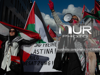 A thousand protesters take part in a protest demanding a ceasefire and opposing ongoing Israeli attacks on Gaza and Lebanon in Duesseldorf,...