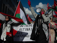 A thousand protesters take part in a protest demanding a ceasefire and opposing ongoing Israeli attacks on Gaza and Lebanon in Duesseldorf,...