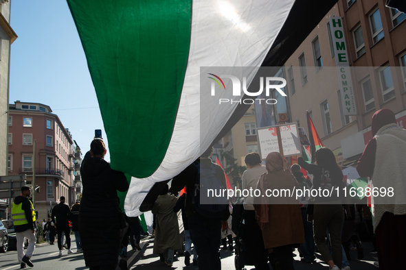 A thousand protesters take part in a protest demanding a ceasefire and opposing ongoing Israeli attacks on Gaza and Lebanon in Duesseldorf,...