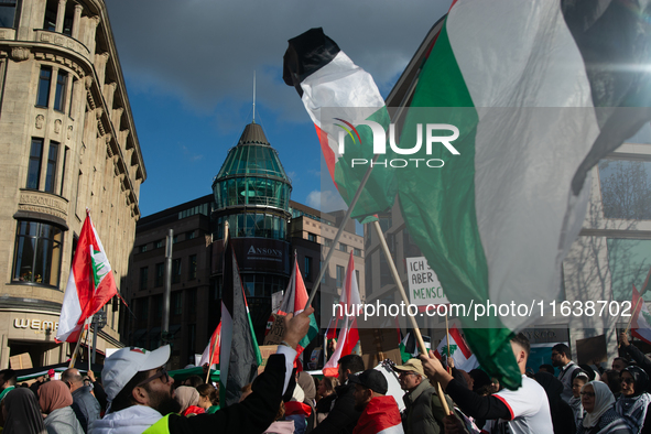 A thousand protesters take part in a protest demanding a ceasefire and opposing ongoing Israeli attacks on Gaza and Lebanon in Duesseldorf,...