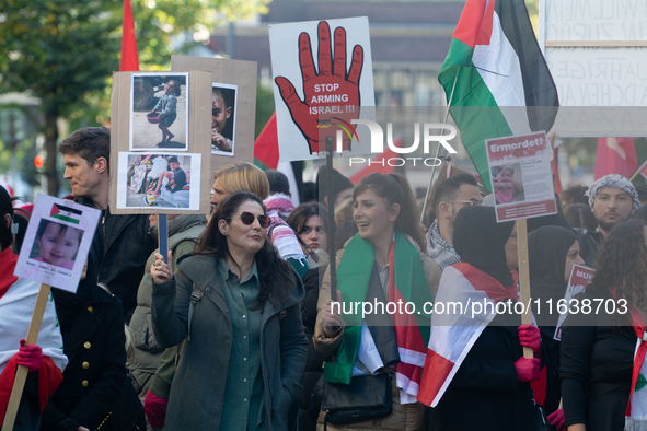 A thousand protesters take part in a protest demanding a ceasefire and opposing ongoing Israeli attacks on Gaza and Lebanon in Duesseldorf,...