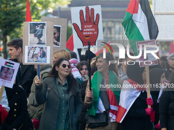 A thousand protesters take part in a protest demanding a ceasefire and opposing ongoing Israeli attacks on Gaza and Lebanon in Duesseldorf,...