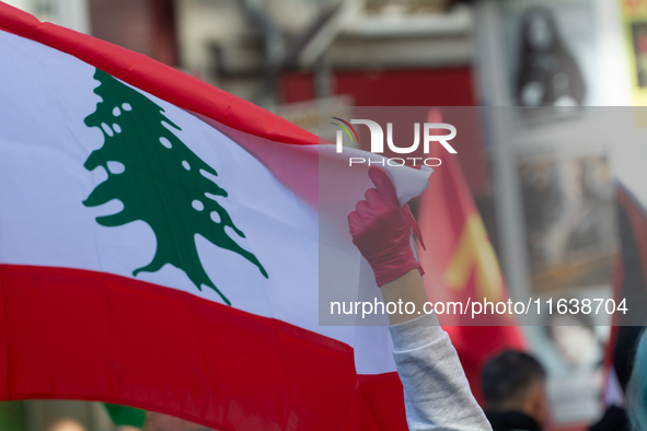 The Lebanon flag is seen as a thousand protesters take part in a protest demanding a ceasefire and opposing ongoing Israel attacks on Gaza i...