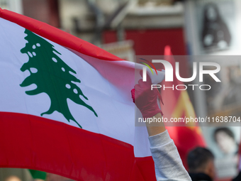 The Lebanon flag is seen as a thousand protesters take part in a protest demanding a ceasefire and opposing ongoing Israel attacks on Gaza i...