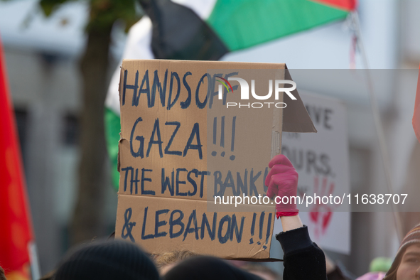 A thousand protesters take part in a protest demanding a ceasefire and opposing ongoing Israeli attacks on Gaza and Lebanon in Duesseldorf,...