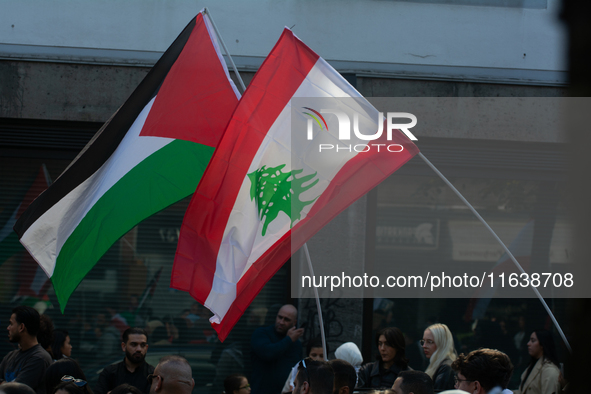 Lebanon and Palestine flags are seen as a thousand protesters take part in a protest demanding a ceasefire and opposing ongoing Israel attac...