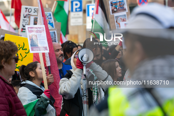 A thousand protesters take part in a protest demanding a ceasefire and opposing ongoing Israeli attacks on Gaza and Lebanon in Duesseldorf,...