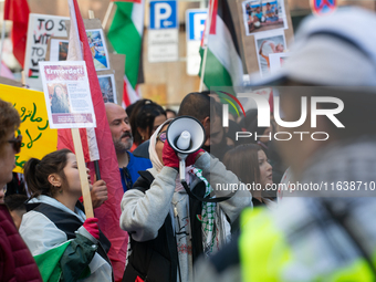 A thousand protesters take part in a protest demanding a ceasefire and opposing ongoing Israeli attacks on Gaza and Lebanon in Duesseldorf,...