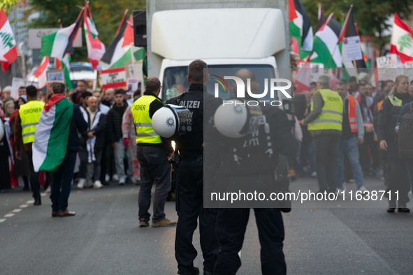 A thousand protesters take part in a protest demanding a ceasefire and opposing ongoing Israeli attacks on Gaza and Lebanon in Duesseldorf,...