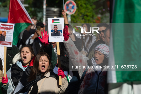 A thousand protesters take part in a protest demanding a ceasefire and opposing ongoing Israeli attacks on Gaza and Lebanon in Duesseldorf,...