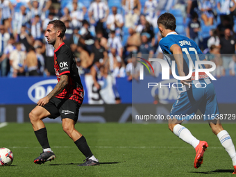 Sergi Darder and Jofre Carreras play during the match between RCD Espanyol and RCD Mallorca in week 9 of LaLiga EA Sports at the RCDE Stadiu...