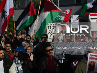 A thousand protesters take part in a protest demanding a ceasefire and opposing ongoing Israeli attacks on Gaza and Lebanon in Duesseldorf,...