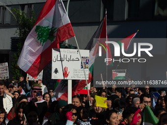 A thousand protesters take part in a protest demanding a ceasefire and opposing ongoing Israeli attacks on Gaza and Lebanon in Duesseldorf,...