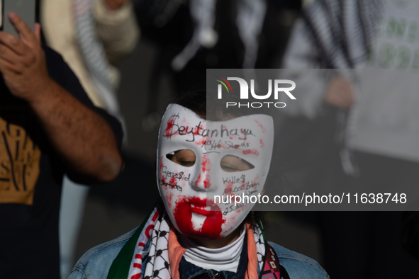 A thousand protesters take part in a protest demanding a ceasefire and opposing ongoing Israeli attacks on Gaza and Lebanon in Duesseldorf,...