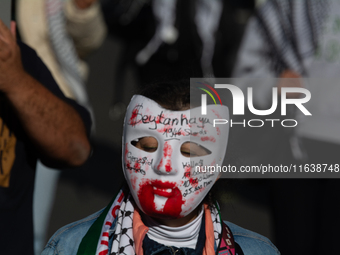 A thousand protesters take part in a protest demanding a ceasefire and opposing ongoing Israeli attacks on Gaza and Lebanon in Duesseldorf,...