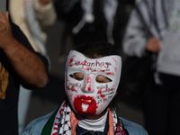 A thousand protesters take part in a protest demanding a ceasefire and opposing ongoing Israeli attacks on Gaza and Lebanon in Duesseldorf,...