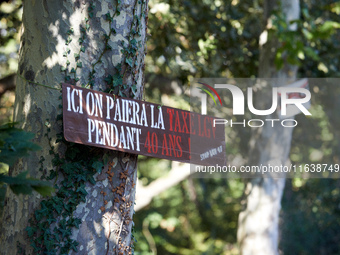 A placard on a tree on the Canal du Midi banks reads 'here, one pays the TGV tax for 40 years'. Zadists, or development protesters, begin to...