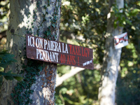 A placard on a tree on the Canal du Midi banks reads 'here, one pays the TGV tax for 40 years'. Zadists, or development protesters, begin to...